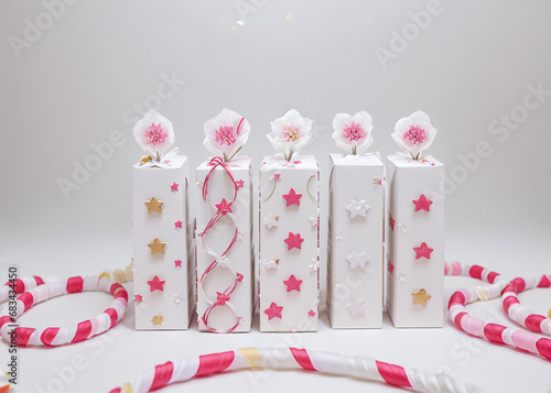 Sparkling bead necklaces, intricate jewellery boxes, and delicate ribbon bows adorn the perfectly wrapped presents, evoking a sense of festive magic and handmade charm. 