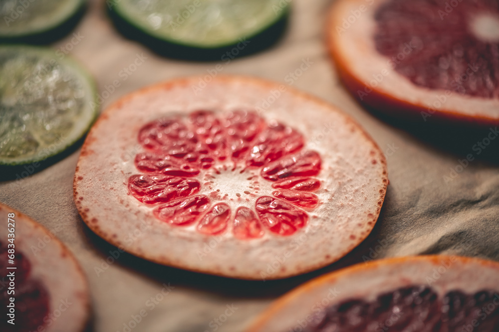 Sliced orange, tangerine and grapefruit slices on baking sheet, preparing citrus wedges for Christmas garland Sliced orange, tangerine and grapefruit slices on baking sheet, preparing citrus wedges for Christmas garland