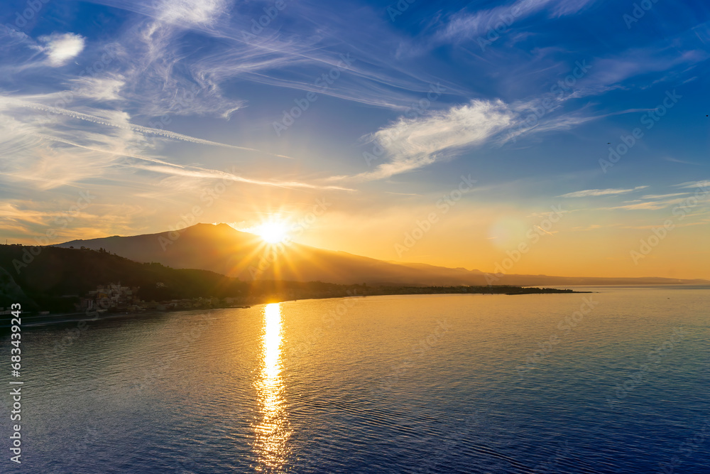 Fototapeta premium picturesque view to a sunset sea gulf with beautiful mountains and amazing cloudy sky on background of nice travel landscape