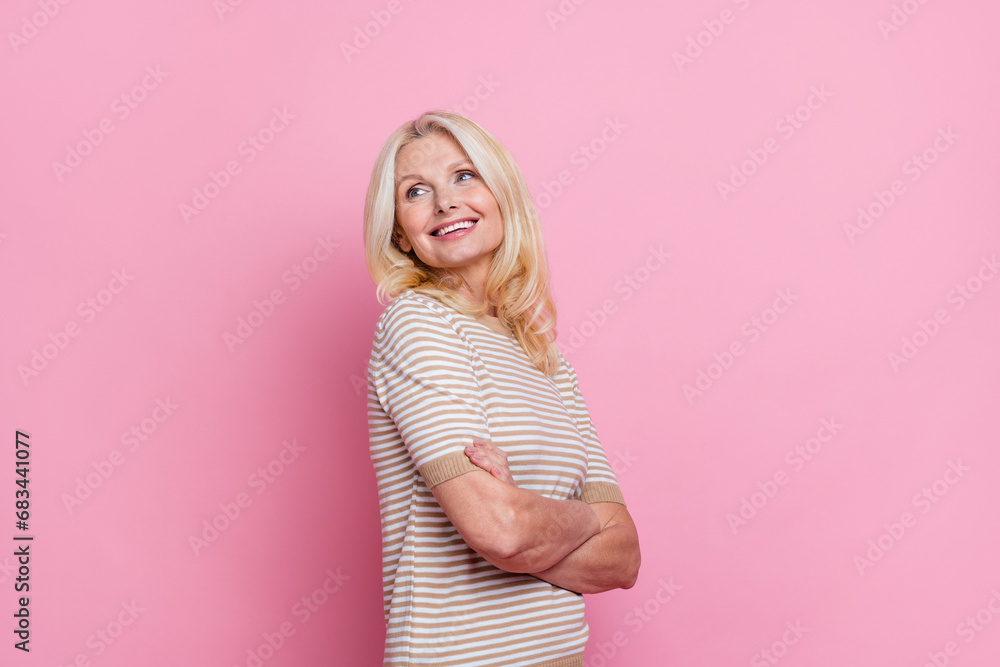 Portrait of dreamy woman with stylish hairdo wear trendy clothes palms folded look at offer empty space isolated on pink color background Portrait of dreamy woman with stylish hairdo wear trendy clothes palms folded look at offer empty space isolated on pink color background