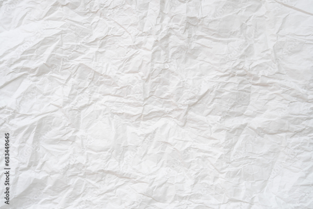 Wrinkled or crumpled white stencil paper or tissue after use in toilet or restroom with large copy space used for background texture in decorative art work Wrinkled or crumpled white stencil paper or tissue after use in toilet or restroom with large copy space used for background texture in decorative art work