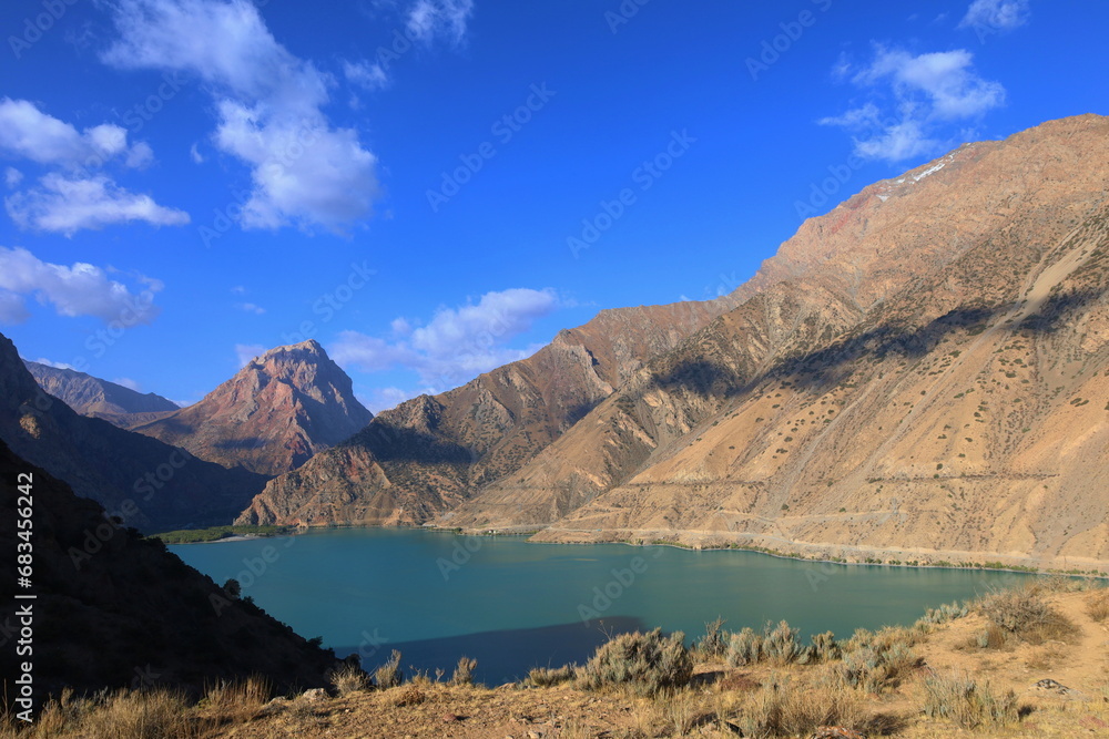 Turquoise mountain lake Iskandarkul located in Fann mountains, Sughd, Tajikistan
