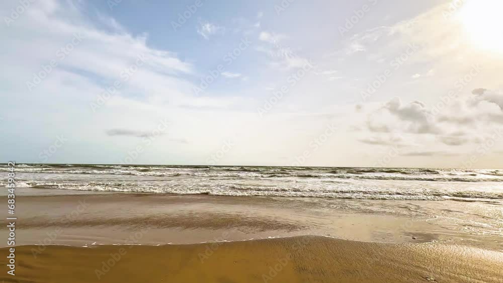 Beach by the sea, yellow sand, blue sky
