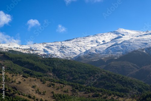 Ski slopes of Pradollano ski resort in Sierra Nevada mountains in Spain photo