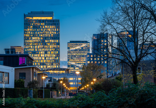 Photography Amsterdam Zuidas in the evening, residential neighbourhood with a view on modern