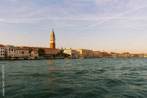 Big san marco tower landscape with italian palaces and canal lagoon water cloudy 