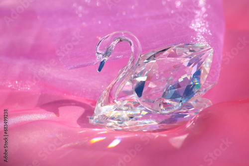 Photos Swarovski swan on a pink satin fabric