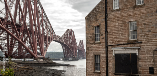 The Forth Bridge, view from North Queensferry town in Edinburgh neighborhood, Scotland industrial landscape photo