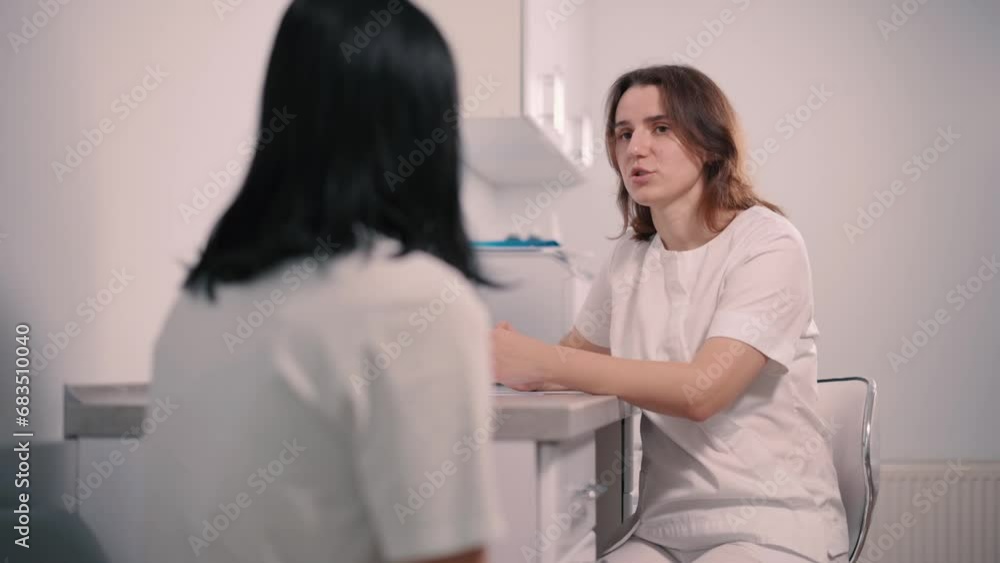 The doctor consults a patient in the clinic. A woman at a gynecologist's appointment. The doctor consults a patient in the clinic. A woman at a gynecologist's appointment.