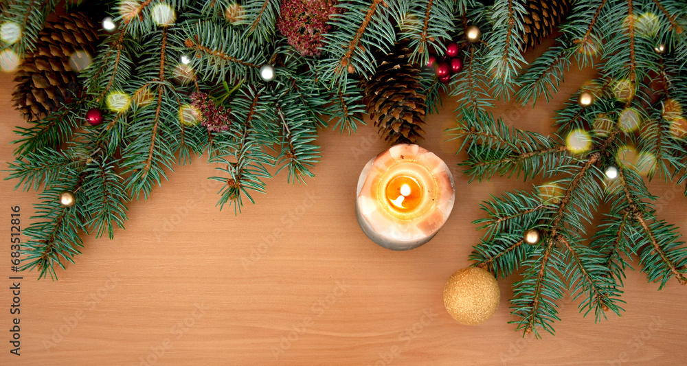 Christmas background. Christmas tree branches, gift, hearts, balls, candle and stars on wooden texture Christmas background. Christmas tree branches, gift, hearts, balls, candle and stars on wooden texture