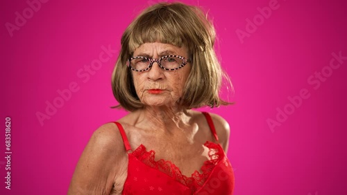 Wallpaper Mural Amusing portrait of angry upset unhappy elderly old woman with no teeth isolated on pink background Torontodigital.ca