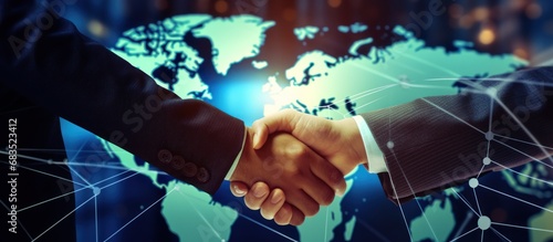 Closeup Businessmen handshake on digital global market graph bar chart diagram background.