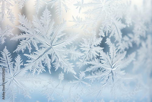 Clear frozen snowflakes on a glass, winter background, in the style of nature-inspired imagery, intricate patterning, whistlerian, matte photo