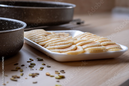 Qatayef plate ready to be filled and stuffed on wooden table