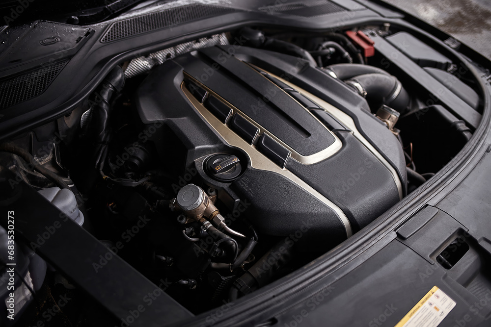 Car engine with opened hood. Car service background