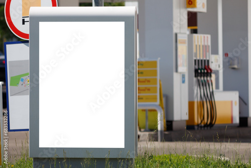 Billboard against a blurry gas station background. Mock-up.