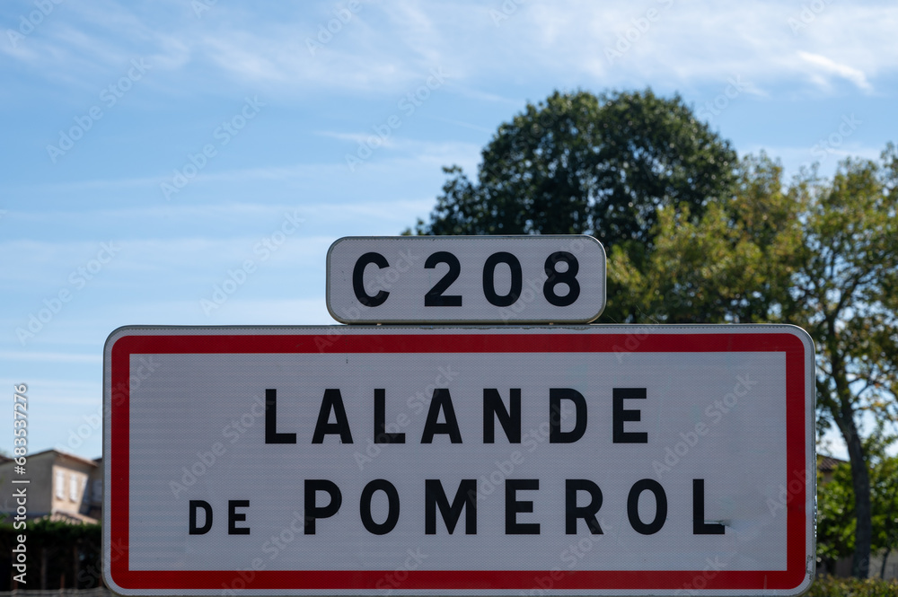 City road sign Lalande de Pomerol near Saint-Emilion wine making region, growing of Merlot or Cabernet Sauvignon red wine grapes, France, Bordeaux