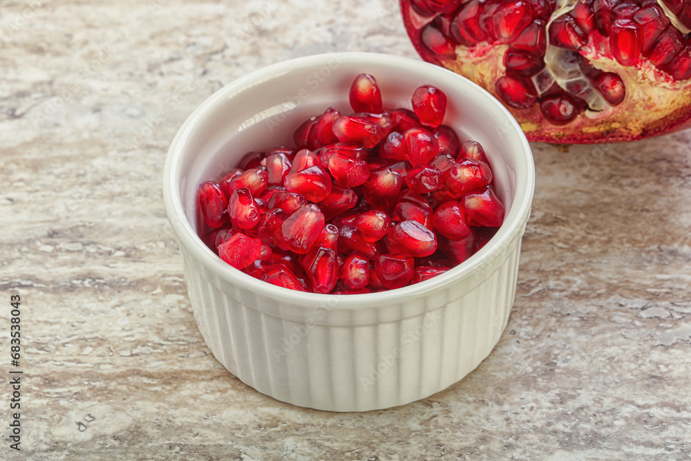 Ripe red Pomegranate seeds in the bowl Ripe red Pomegranate seeds in the bowl