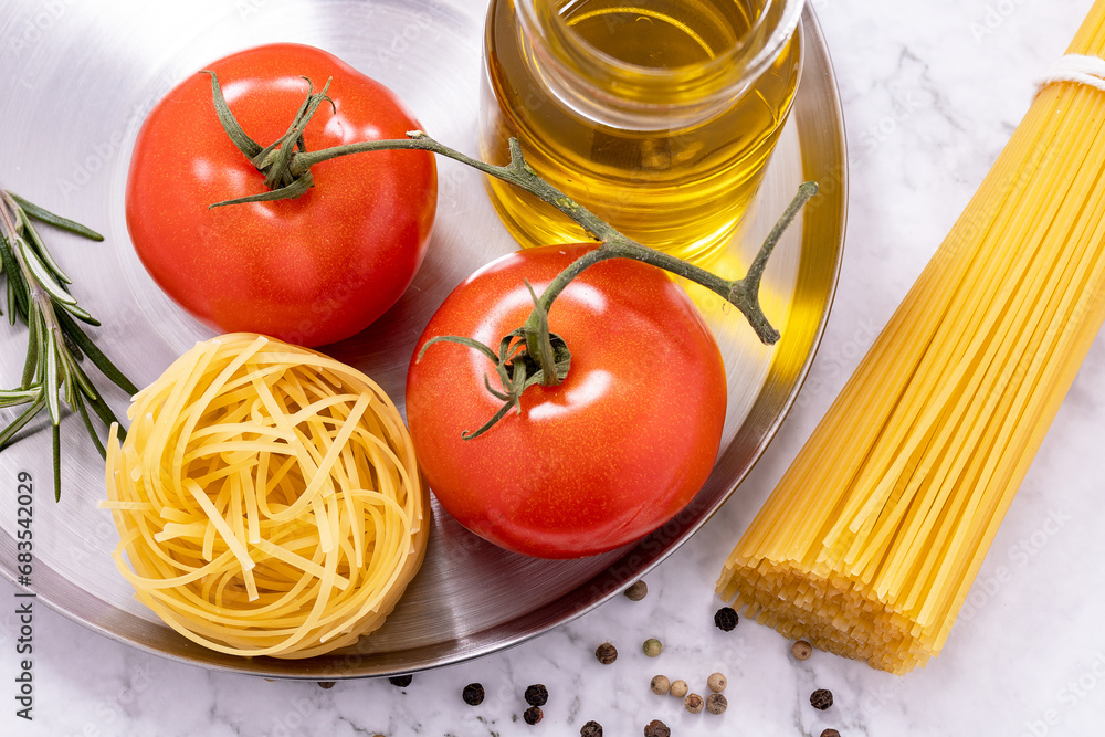 Spaghetti pasta, noodles, tomatoes and oil Spaghetti pasta, noodles, tomatoes and oil