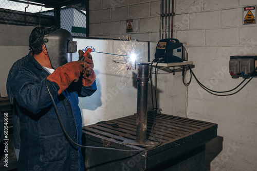 Welder working in workshop