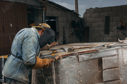 welder working with loader