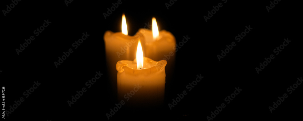 Midnight Embrace: Three Candles Dancing in Shadows