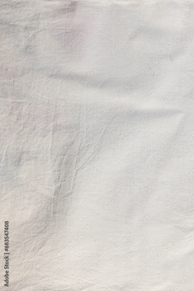 Eco-friendly natural material. White cotton fabric slightly wrinkled texture.