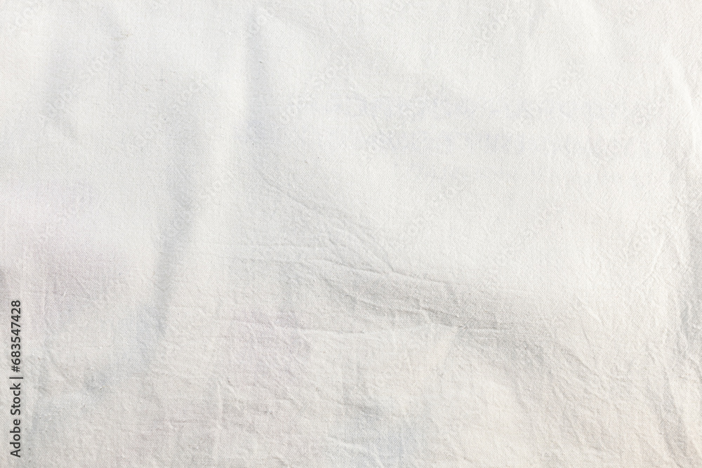 Eco-friendly natural material. White cotton fabric slightly wrinkled texture.