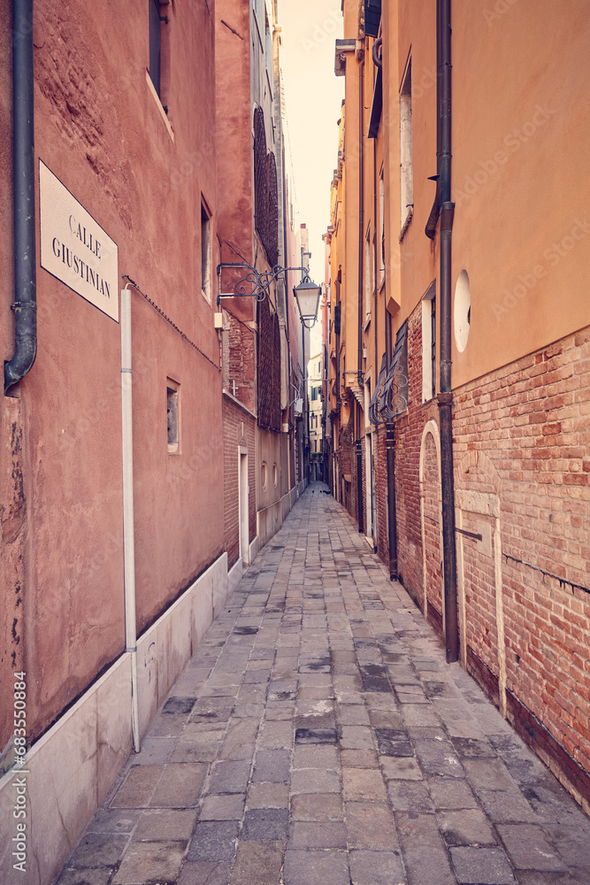 Old narrow street in Venice city, Italy