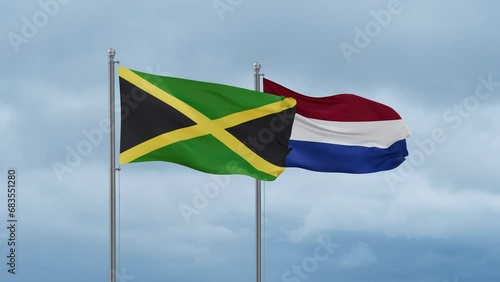 Netherlands flag and Jamaica flag waving together on cloudy sky, endless seamless loop, two country relations concept photo