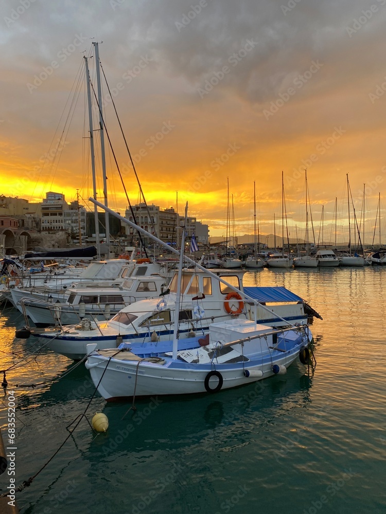 Sunset Crete island Heraklion marina country, boats in harbour 