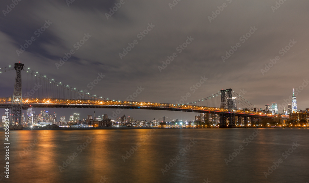 The Williamsburg Bridge is a suspension bridge in New York City across the East River connecting the Lower East Side of Manhattan at Delancey Street with the Williamsburg neighborhood of Brooklyn
