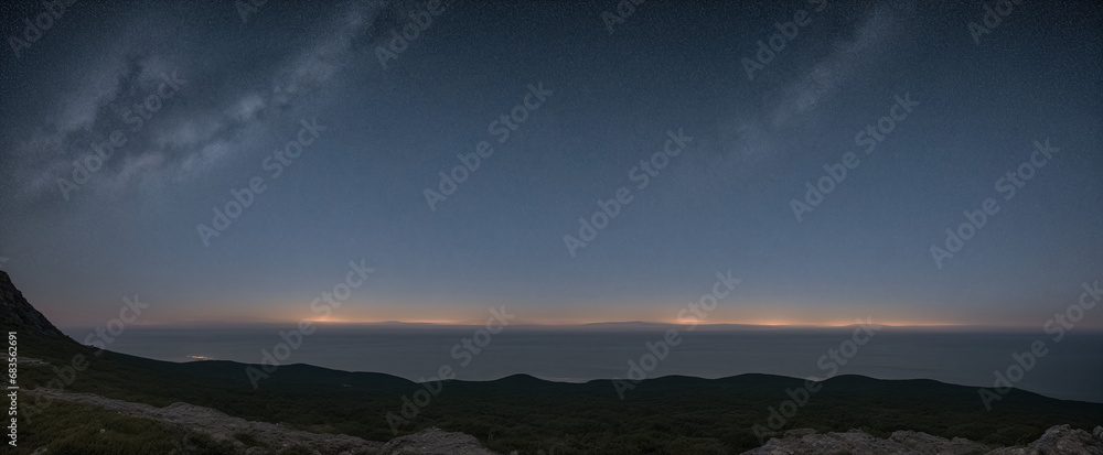 Sea and night sky with milky way, stars, view from a hill, stars are slightly visible in the sky, distant mountains on the horizon, distant sunset on the horizon