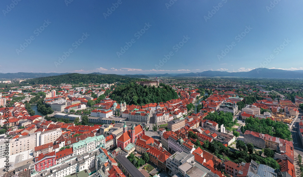 Ljubljana old town in Slovenia. Ljubljana is the largest city. It's known for its university population and green spaces, including expansive Tivoli Park. The curving Ljubljanica River. Drone