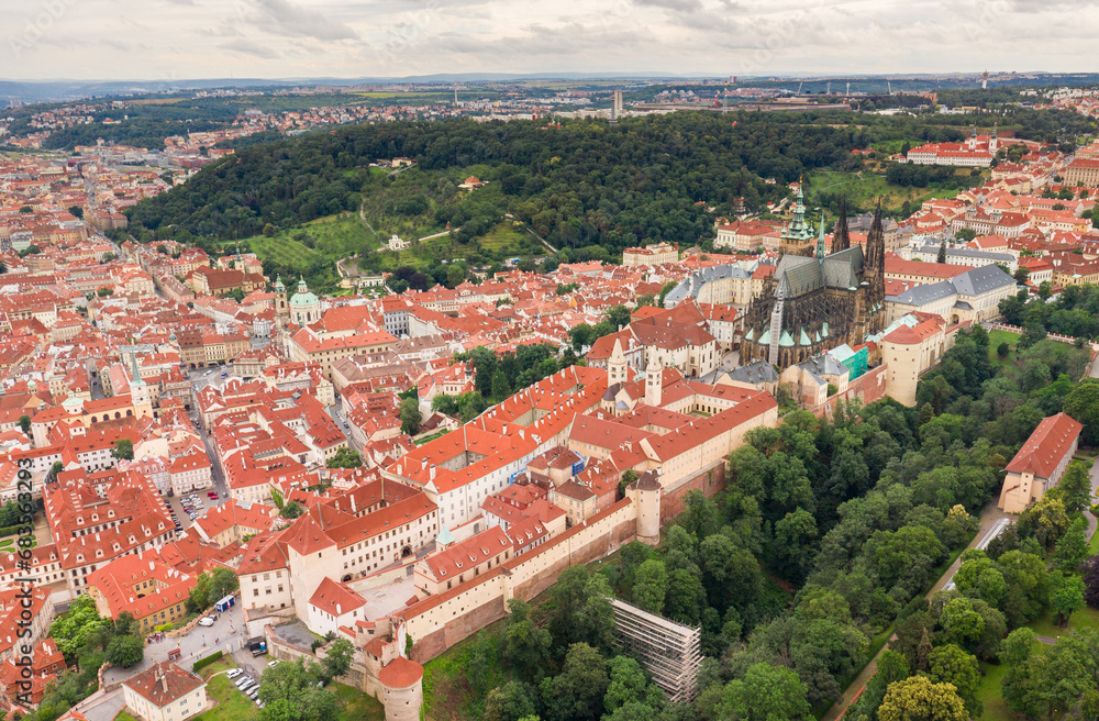 Obraz premium Prague Old Town with St. Vitus Cathedral and Prague castle complex with buildings revealing architecture from Roman style to Gothic 20th century. Prague, capital city of the Czech Republic. Drone