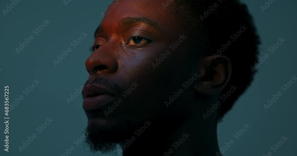 CLose up shot handsome attractive man stands isolated in studio looking into distance in bright natural light showing serious concentrated emotions. Futuristic concept advertisement of future. CLose up shot handsome attractive man stands isolated in studio looking into distance in bright natural light showing serious concentrated emotions. Futuristic concept advertisement of future.