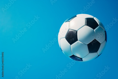 Striking Soccer Ball in Goal on Vibrant Blue Background - Created with Generative AI Tools