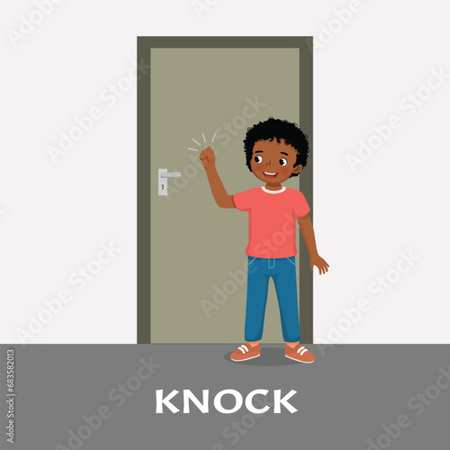 Cute little African girl knocking at the door 