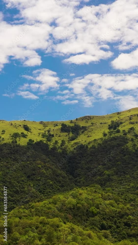 Top view of Mountains with green forest a background of blue sky and clouds. Sri Lanka. Top view of Mountains with green forest a background of blue sky and clouds. Sri Lanka.