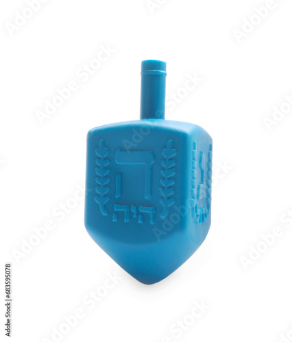 One light blue dreidel isolated on white. Traditional Hanukkah game photo