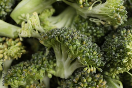 Fresh raw broccoli as background, closeup view
