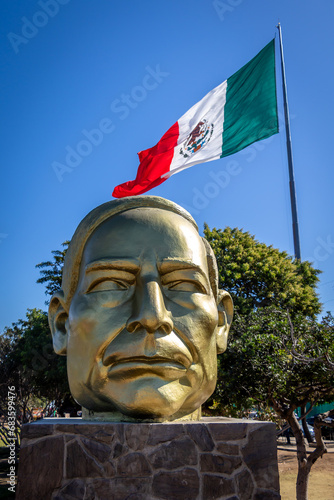 A Large Gold Memorial Bust of Benito Juarez in Ensenada, Mexico photo