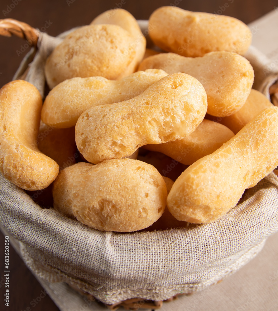 Brazilian starch biscuit in a basket( biscoito polvilho made with tapioca or cassava flour ). Typical Brazilian biscuit