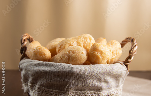 Front View Brazilian starch biscuit in a basket( biscoito polvilho made with tapioca or cassava flour ). Typical Brazilian biscuit photo