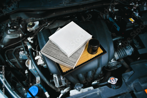 Car air filter and car oil filter on engine cover in engine compartment , Car spare parts concept
