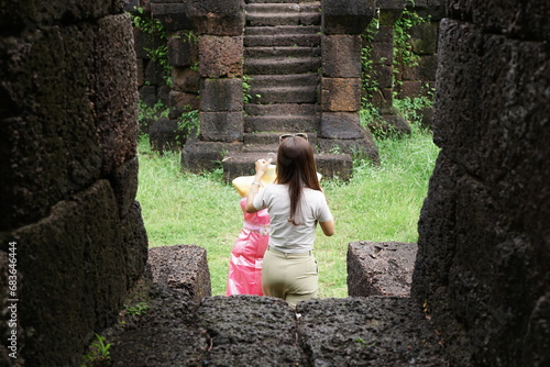 Women bring Thai costumes to worship sacred objects at Nang Phaya Castle, Buntharik District, Ubon Ratchathani Province, Thailand. photo