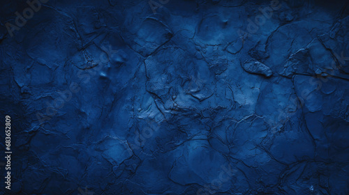 Black dark navy blue texture background for design. Toned rough concrete surface. A painted old building wall with cracks. Close-up. Distressed, broken, crushed, collapsed, destruction. 