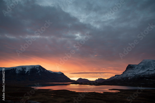 Colorful September morning sky in the Scandinavian Mountains  sky reflecting on a lake  Kiruna region  Swedish Lapland