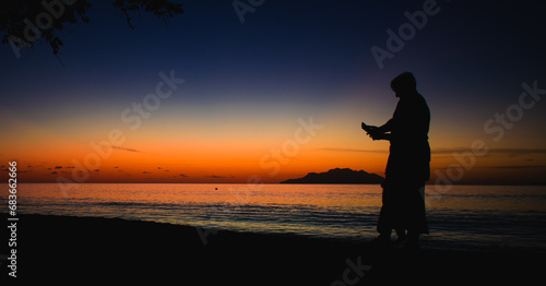 Sunset with a man in Seychelles beach