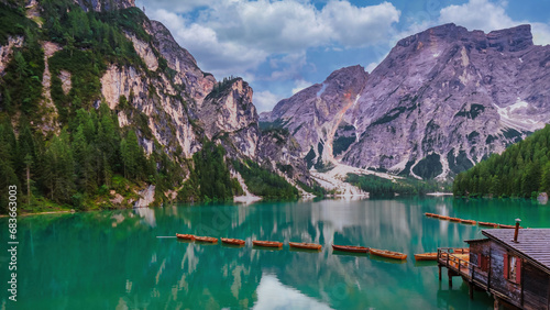 Lake Braies also known as Pragser Wildsee or Lago di Braies in Dolomites Mountains, Sudtirol, Italy. Romantic place with typical wooden boats on the Alpine lake during summer
